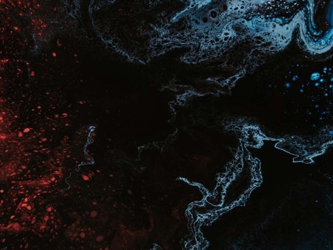 abstract flowing colors of red and blue in a sea of black